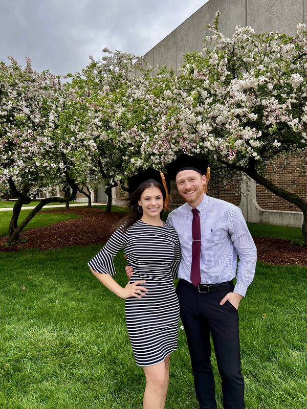 Kathleen celebrating graduation with Mitchell