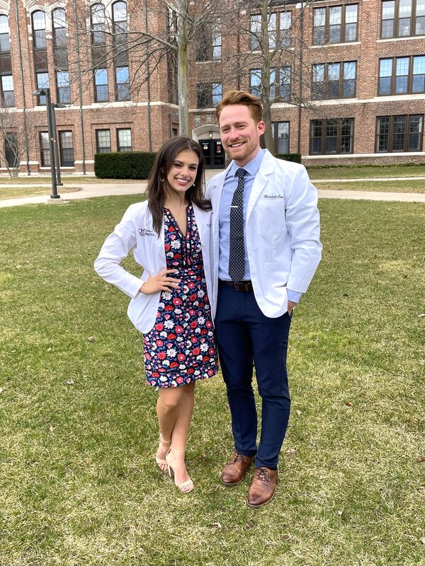 Kathleen at her White Coat Ceremony with Mitchell by her side